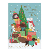 This cute christmas card from the dog is decorated with a pack of happy, festive dogs playing among a stack of Christmas gifts. Gold text on the front of the card reads "Merry Christmas from the Dog".