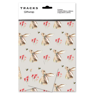 Perfect for any occasion, this premium gift wrap pack contains two sheets of taupe-coloured wrapping paper and matching tags covered with a repeated sketch of a hare looking up at a bumble bee. The convenience of the pre-folded and pre-wrapped sheets make gift-giving hassle-free.