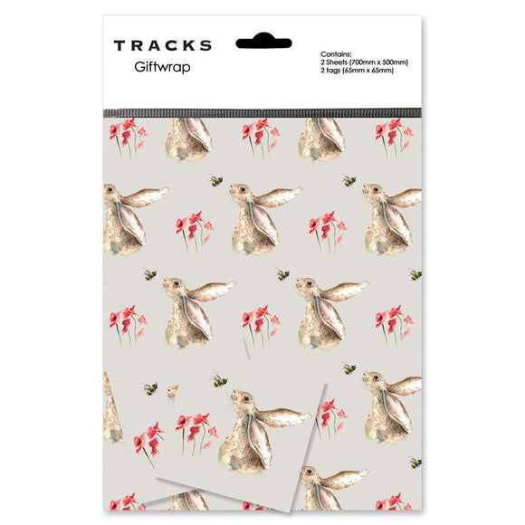 Perfect for any occasion, this premium gift wrap pack contains two sheets of taupe-coloured wrapping paper and matching tags covered with a repeated sketch of a hare looking up at a bumble bee. The convenience of the pre-folded and pre-wrapped sheets make gift-giving hassle-free.