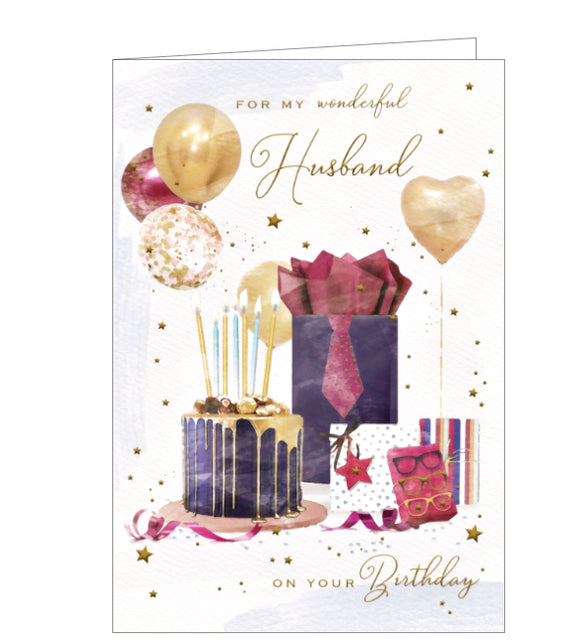 This birthday card for a special husband is decorated with an arrangement of beautifully wrapped birthday gifts, a blue and gold drip-decorated birthday cake and golden balloons .Silver text on the front of this card reads 