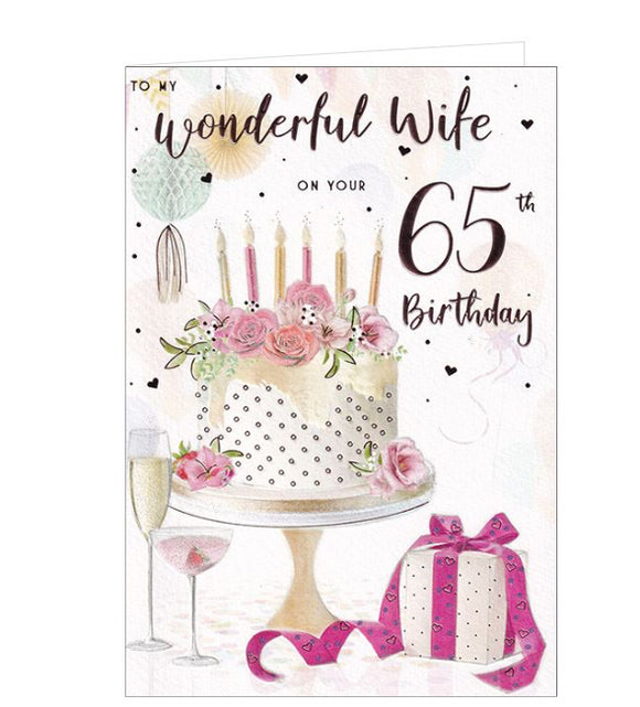 A truly gorgeous birthday card for a wife on her 65th birthday. This card is illustrated with a large beautiful cake with coloured candles, and party decorations. The text on the front of the card reads 