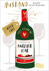 This lovely anniversary card for a special husband is decorated with a large green bottle that reads Let's Celebrate..Cheers to another year. At the to of the card the Text says   "Husband..Happy  anniv