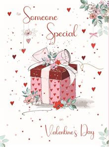 Celebrate love with our "For Someone Special" Valentine's Day card. Adorned with small hanging hearts and muted florals on a white background, its centrepiece is a charming red box and ribbon-wrapped present. Show your special someone just how much they mean to you with this beautifully crafted card. Fold out into three pages.