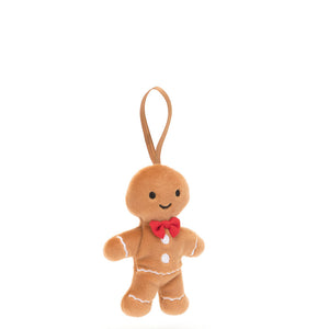 Returning for Christmas 2024 Jellycat's Festive Folly Gingerbread Fred is a dapper addition to your Christmas decor! With soft ginger fur, embroidered icing cuffs and buttons, a red bow tie and toffee ribbon loop, this smiley guy has impeccable style!