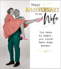This anniversary card for a very special wife features a vintage, colourised photograph of a man carrying a woman in his arms. The text on the front of the card reads "Happy Anniversary to my Wife...You have to admit, you could have done worse!"