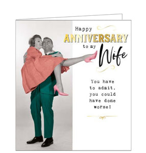 This anniversary card for a very special wife features a vintage, colourised photograph of a man carrying a woman in his arms. The text on the front of the card reads "Happy Anniversary to my Wife...You have to admit, you could have done worse!"