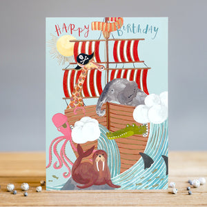 Spice up your little one's birthday with this fun and colourful card featuring a pirate crew sailing the high seas aboard their pirate ship - but this very special crew is made up of a giraffe, an elephant, a walrus, octopus and a crocodile!