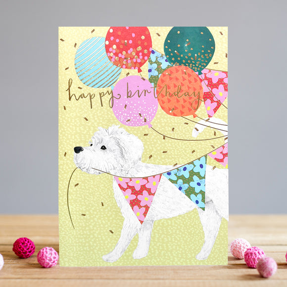 This Louise Tiler birthday card is the perfect way to wish someone a happy birthday. Featuring a white dog enthusiastically tugging at a string of bunting, colourful balloons, and gold confetti, this card is sure to bring a smile to the recipient's face. Gold text on the front of the card reads 