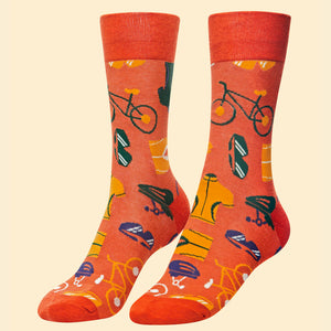 This pair of mens socks from fashion brand Powder are decorated with the accessories every cyclist needs including shorts, bike, helmet and jersey. These socks are knitted in a retro-colour palette of orange, yellow, purple and white.