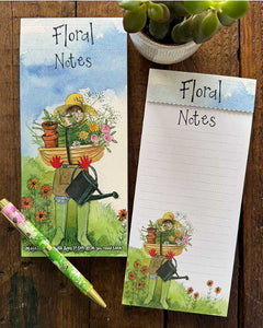 Stay organised in the sweetest way with this beautifully designed magnetic listpad by Alex Clark, featuring detail from an artwork showing a gardener - in wellies, straw hat and gardening gloves - hidden behind a trug of flowers and flower pots. The caption on the front of the listpad reads "Floral Notes".