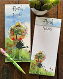 Stay organised in the sweetest way with this beautifully designed magnetic listpad by Alex Clark, featuring detail from an artwork showing a gardener - in wellies, straw hat and gardening gloves - hidden behind a trug of flowers and flower pots. The caption on the front of the listpad reads "Floral Notes".