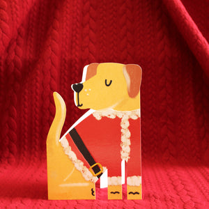 This adorable and unusual christmas card is cut into the shape of a lovely yellow labrador dog dressed in a santa-style jacket. 