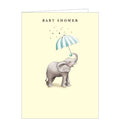 Sweet and simple, this pale yellow baby shower greetings card is decorated with an illustration of a baby elephant holding a blue and white umbrella in his trunk. Gold text on the front of the card reads "Baby shower"