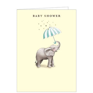 Sweet and simple, this pale yellow baby shower greetings card is decorated with an illustration of a baby elephant holding a blue and white umbrella in his trunk. Gold text on the front of the card reads "Baby shower"