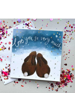 The lovely Valentine's card features Alex Clark's illustration of a pair of bunnies looking up into a starry sky in which is written "love you so very much"