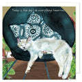 A cute and funny greetings card showing a white cat asleep on a chair