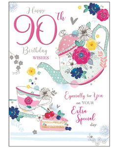 Celebrate a truly special milestone with this elegant 90th birthday card from Jonny Javelin. Featuring one of the brand’s signature illustrations, the design showcases a charming floral teapot, teacup, and slice of cake, all beautifully accented with metallic foil and flitter details for a sparkling finish.

The front of the card reads: "Happy 90th Birthday Wishes...Especially for You on Your Extra Special Day".