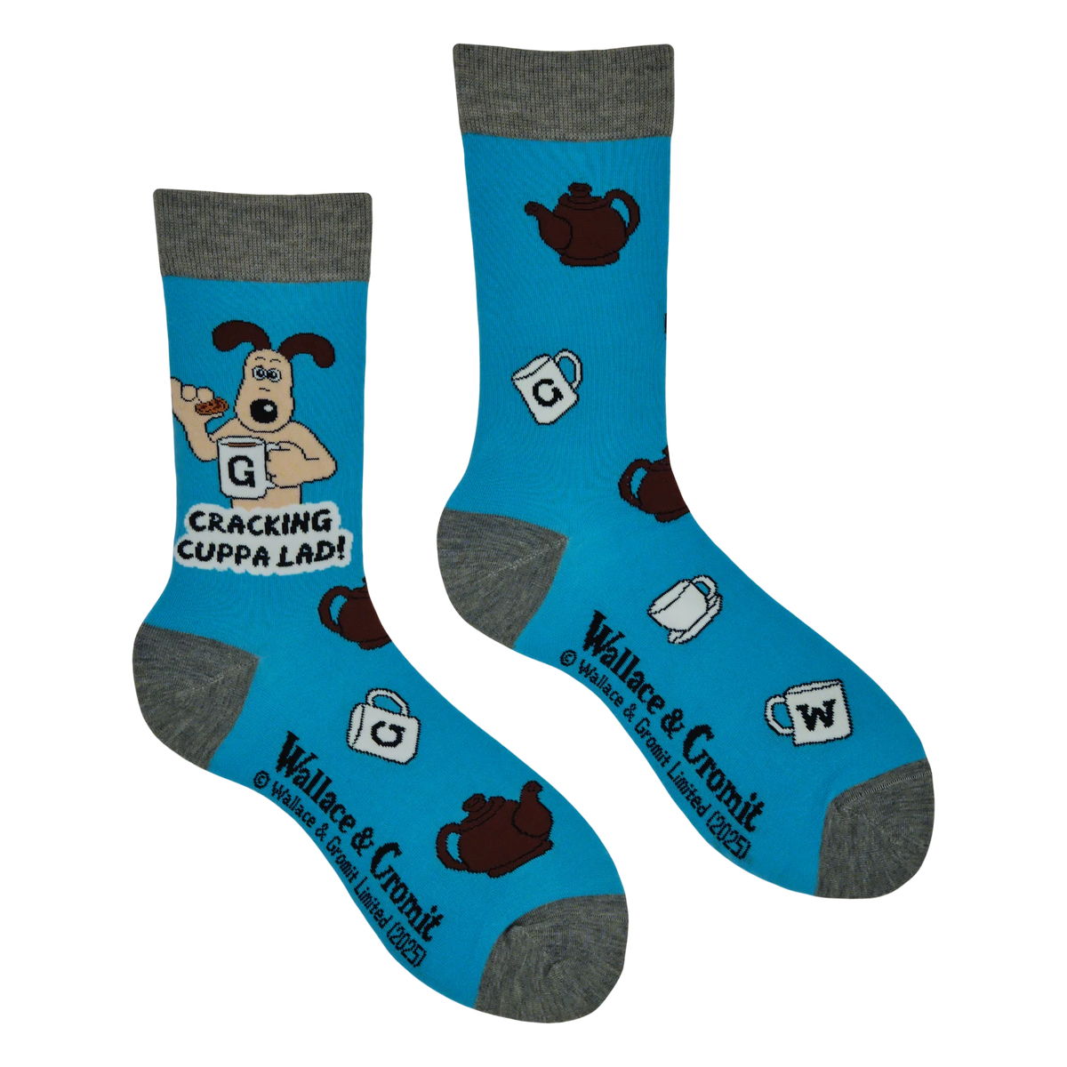 Blue adult crew socks from socktopus with grey toes and heels featuring official Wallace and gromit art of gromit holding a cup of tea with teacups and tea pots around