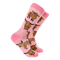 Pink adult crew socks from Socktopus featuring orange highland cows (coos)