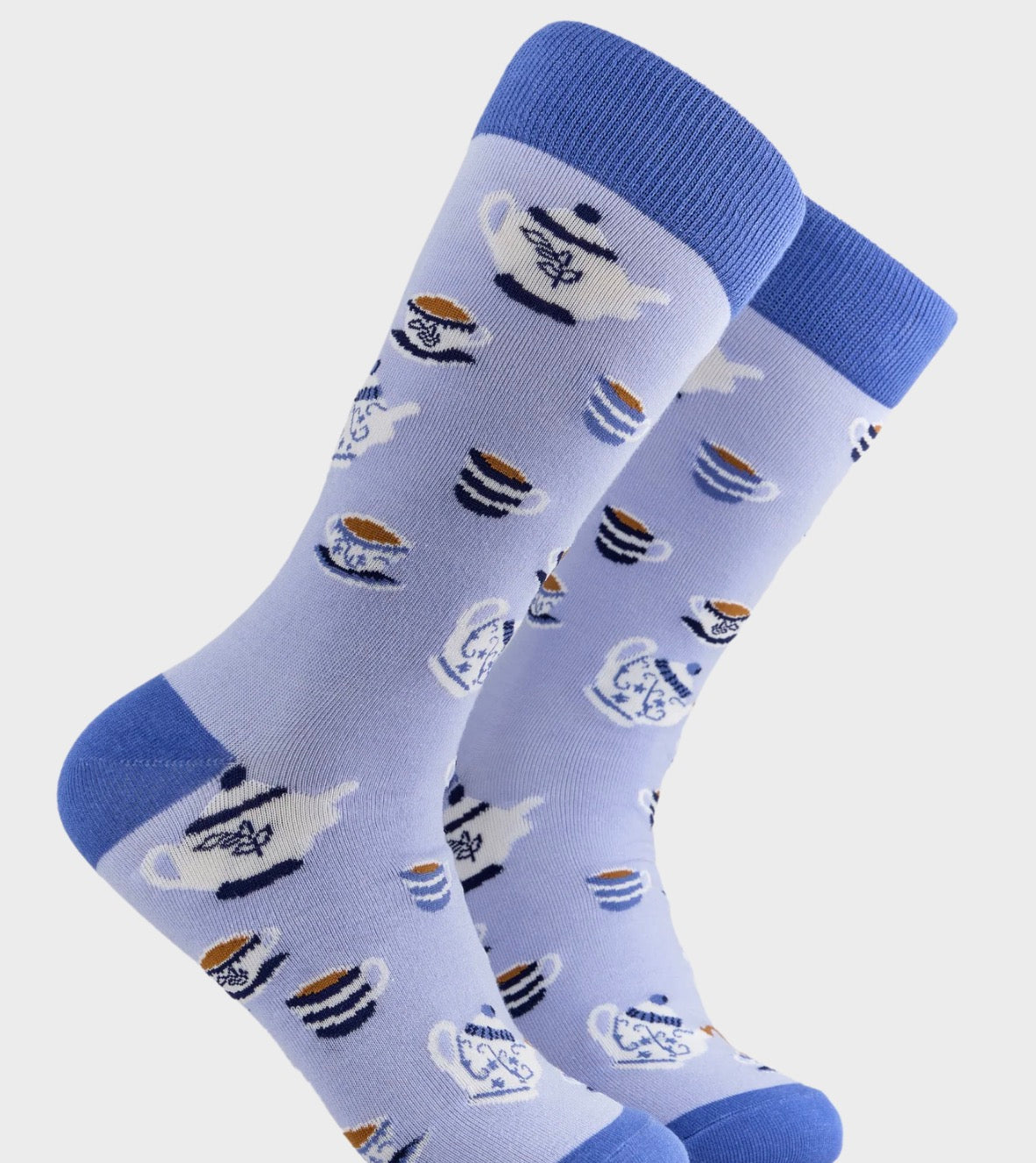 Socktopus adult crew socks with tea cups and teapots design on a light blue background with darker blue toes and heels