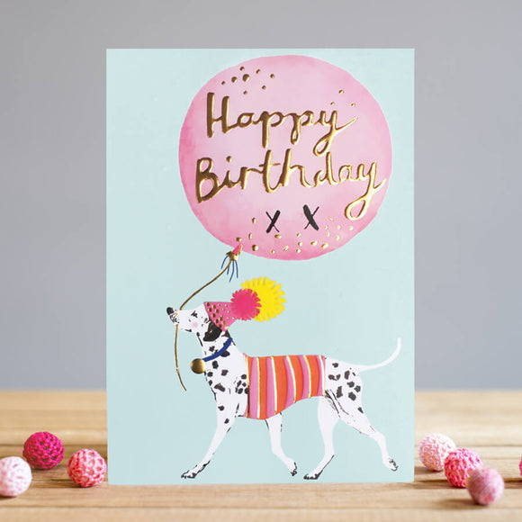 This Louise Tiler birthday card features a cute dalmatian dog, sporting a hat and coat, carrying a large balloon. Celebrate the recipient's birthday in style with this card, featuring a fun, mint green background. Text on the large pink balloon reads 