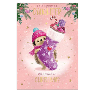 Here's Hartley the Hedgehog to wish a special daughter a merry, snowy Christmas. Hartley is holding a purple christmas stocking -&nbsp; larger than the hedgehog itself - overflowing with presents, against a pink background dotted with gold stars. The caption on the front of this Christmas card reads "To a Special Daughter...with love at Christmas".