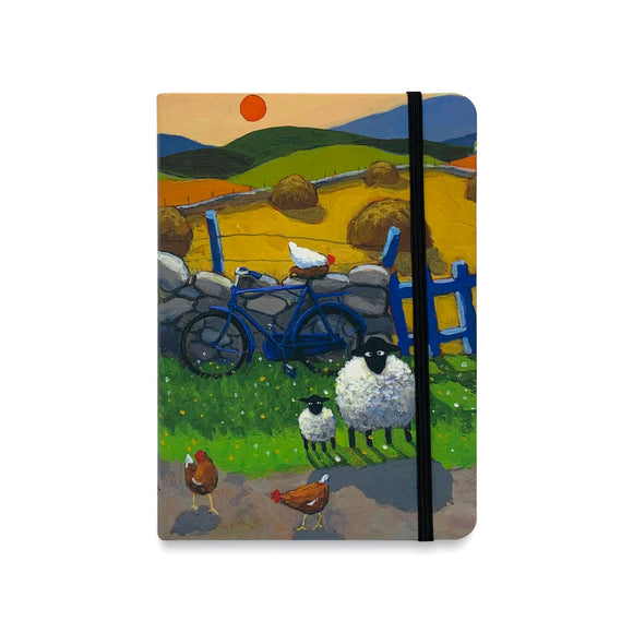 Perfect for anything from plotting your novel to planning world domination, or just keeping track of your shopping list, this flexible notebook is decorated with a sketch by Thomas Joseph showing  two sheep on the roadside with a bicycle leaning against the wall behind them.
