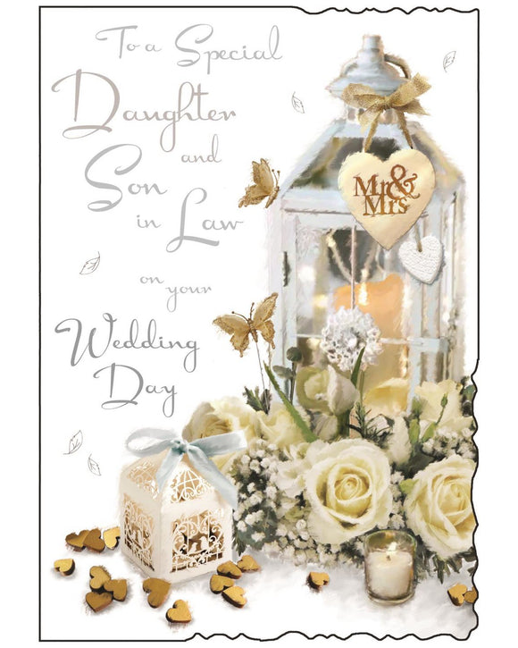 Celebrate your daughter’s special day with this beautifully designed wedding card for a daughter and son-in-law by Jonny Javelin. Featuring a delicate illustration of a romantic lantern surrounded by soft white roses, a wedding favour box, and heart-shaped confetti, it captures the elegance and joy of a wedding celebration. The front of the card is finished with shimmering silver foil text that reads 