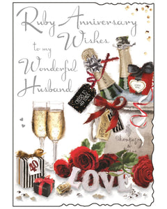 Celebrate your 40th wedding anniversary in style with this beautifully illustrated Jonny Javelin Ruby Anniversary card for a special husband. The elegant front design features a romantic table scene adorned with a bouquet of red roses, sparkling champagne, and thoughtful gifts - perfectly capturing the spirit of love and celebration.&nbsp;The heartfelt message on the front reads "Ruby Anniversary Wishes to My Wonderful Husband."

A touching keepsake for this milestone occasion, this high-quality greeting ca
