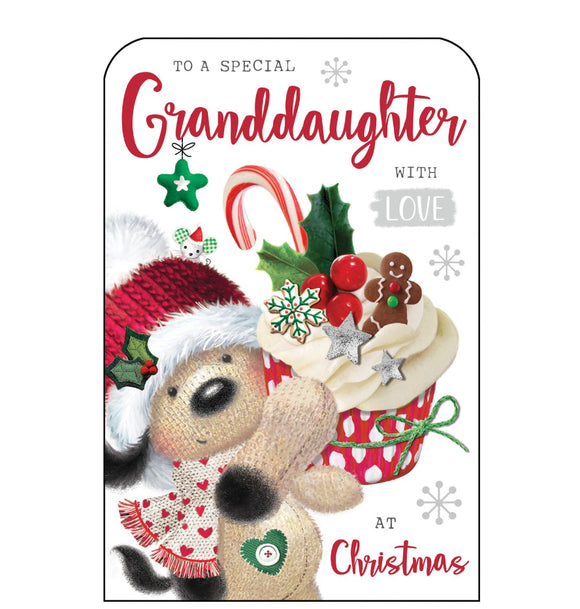 This Christmas card for a special Grandaughter  is decorated with Fudge the dog holding up a giant festive cupcake - topped with a sprig of holly and a candy cane. Glittery red text on the front of this Christmas card reads 