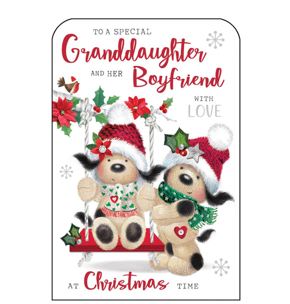 This Christmas card for a special granddaughter and her boyfriend is decorated with Fudge the dog, dressed in a woolly hat and scarf, pushing his girlfriend on a swing. Glittery red text on the front of this Christmas card reads 