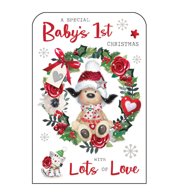This Christmas card for to celebrate baby's first Christmas is decorated with Fudge the dog perched on a festive wreath. Glittery red text on the front of this Christmas card reads 