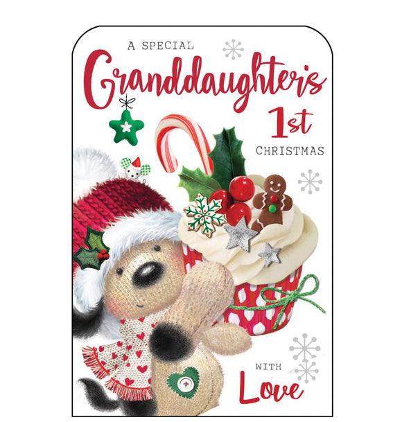 This Christmas card for a special granddaughter's first christmas is decorated with Fudge the dog holding up a huge festive cupcake, topped with a glittery candy cane, a sprig of holly and gingerbread men. Glittery red text on the front of this Christmas card reads 