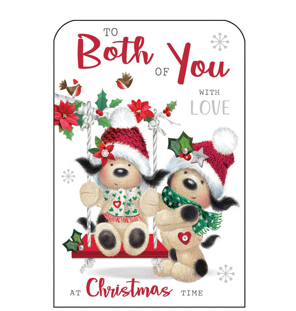 This Christmas card for a special couple is decorated with Fudge, a cute knitted dog, dressed in a hat and scarf, pushing another knitted down on a swing. Silver and glittery red text on the front of this Christmas card reads 