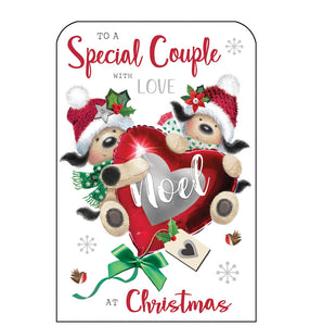 This Christmas card for a special couple is decorated with two cute knitted dogs, dressed in hats and scarves, hanging on to a large, red festive heart-shaped balloon. Silver and glittery red text on the front of this Christmas card reads "To a Special Couple with love at Christmas"