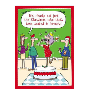 This funny Christmas card features a cartoon showing a christmas party - with a woman holding a glass in one hand and a microphone in the other, performing karaoke. One of the partygoers says "It's clearly not just the Christmas card that's been soaked in brandy!"