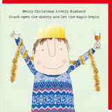 This Christmas card features one of Rosie Made a Thing's unmistakably witty and charming illustrations showing a man wearing a paper party hat and a festive jumper. The caption on the front of the card reads "Merry Christmas lovely Husband...Crack open the sherry and let the magic begin".