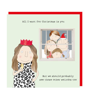 This Christmas card features one of Rosie Made a Thing's unmistakably witty and charming illustration showing a crowd of family and friends looking in through a window as as woman in a party dress and paper crown drinks champage. The caption on the front of the card reads "All I want for Christmas is you...But we should probably see those other weirdos too".