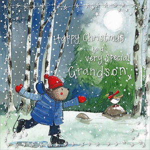 Part&nbsp;of Alex Clark's Christmas card collection, this Christmas card is decorated with Alex's painting of a hedgehog, wearing a coat and hat, on its hind legs, skating in a snowy forest clearing. SIlver&nbsp;text on the front of the card reads "Happy Christmas to a very special Grandson".