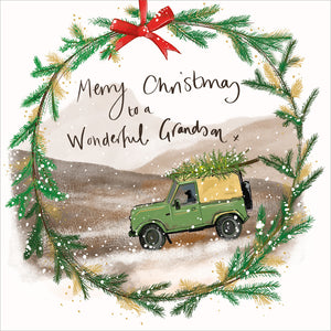 Part of Alex Clark's Christmas card collection, this Christmas card for a special grand-son is decorated with Alex's painting of a&nbsp; landrover with christmas tree driving over the moor. A Christmas wreath forms a border. The text on the front of the card reads "Merry Christmas to a wonderful Grandson.".