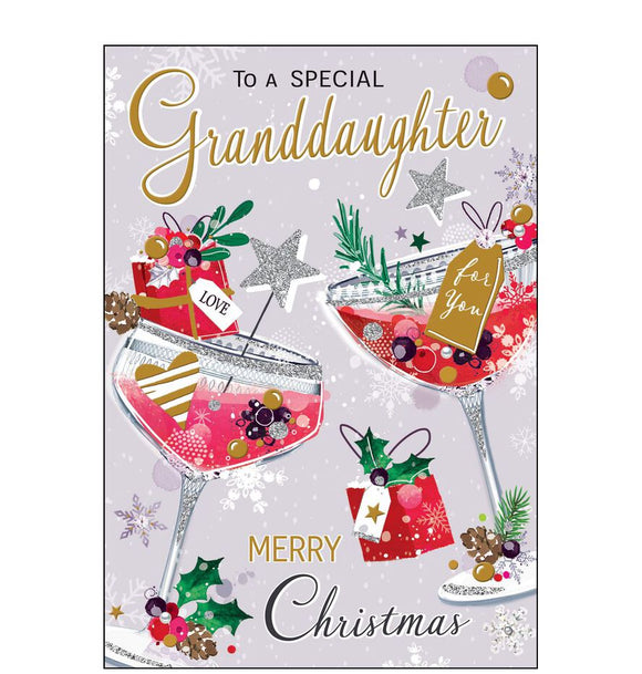 This stylish Jonny Javelin Christmas card is decorated with an illustration a pair of glittering pink cocktails, garnished with sprigs of winter foliage. Gold text on the front of the card reads 