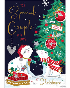 This adorable christmas card for a special couple is decorated with an illustration of two polar bears sitting nose-to-nose beside a beautifully decorated Christmas tree. Gold text on the front of the card reads "To a Special Couple with Love at Christmas".