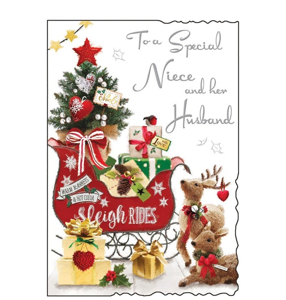 This Christmas card for a special niece and husband is decorated with red sleigh piled high with christmas gifts, parked beside a pair of wicker reindeer. Silver text on the front of this Christmas card reads 