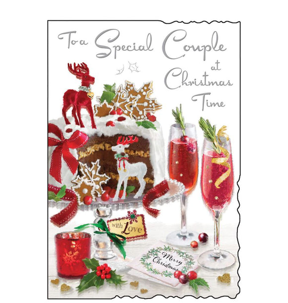 This Christmas card for a special couple is decorated with a beautifully decorated Christmas cake - with a slice cut from it, beside a pair of champagne glasses filled with mulled wine. Silver text on the front of this Christmas card reads 