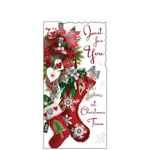 This money wallet is decorated with a traditional Christmas image of red stockings hanging from a Christmas decoration. Red text on the front of the card reads "Just for You at Christmas Time".