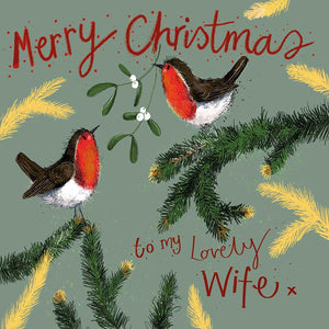 Part of Alex Clark's Christmas card collection, this Christmas card for a special wife is decorated with Alex's painting of two robins perched on branches. One robin is holding a sprig of mistletoe in its beak. The text on the front of the card reads "Merry Christmas to my lovely Wife x".