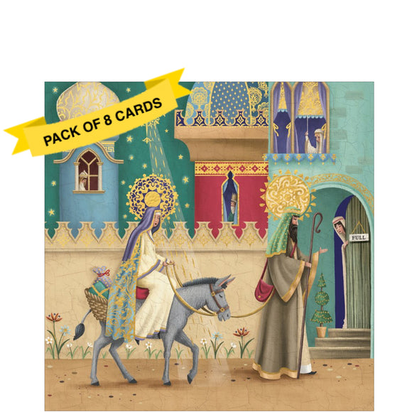 These 8 charity Christmas cards feature a brightly coloured illustration of Joseph guiding Mary on a donkey through the streets of Bethlehem