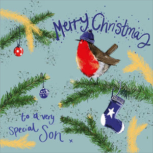 Part of Alex Clark's Christmas card collection, this Christmas card for a special son is decorated with Alex's painting of a robin, wearing a blue bobble hat, perched on a fir-tree branch. The text on the front of the card reads "Merry Christmas to a very special Son x".