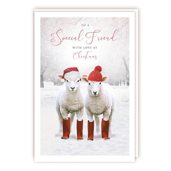 A wonderful country themed Christmas card for a special friend with two sheep in red hats and wellies looking out from a winter landscape. The caption on the front of this Christmas card reads 