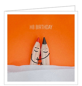 This cute and quirky birthday card is sure to brighten anyone's day. The card is decorated with a photograph of two sharply pointed crayons arm in arm. The text on the front of the card reads "HB Birthday".